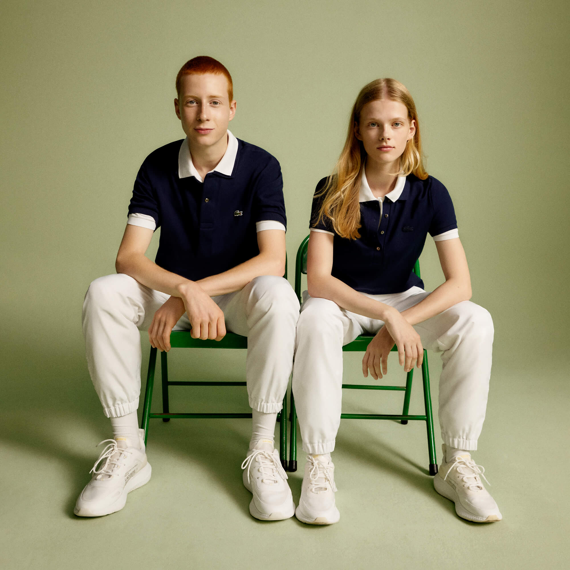 Lacoste Slim Fit Polo Shirt on men and women sitting next to each other